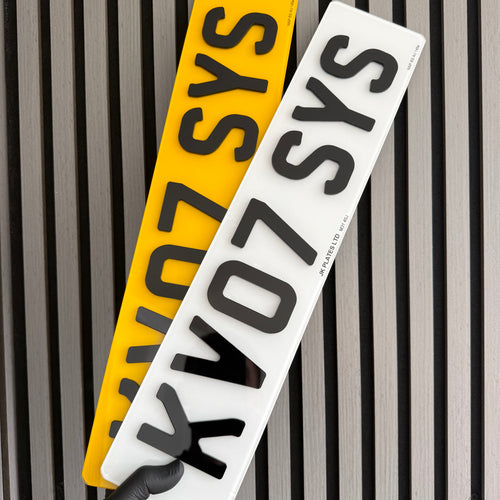 4D acrylic number plates with raised characters in white and yellow