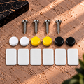 Number plate fixing kit with screws, caps and adhesive pads